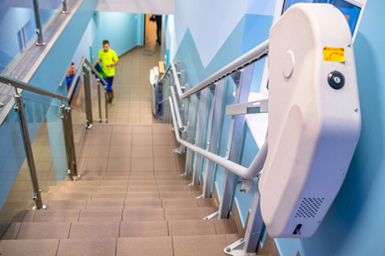 staircase with handrails and disabled lift